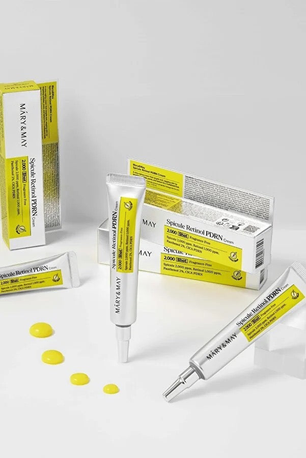 Mary&May Spicule Retinol PDRN Cream tubes and outer boxes with yellow cream droplets — EmartGCC Kuwait