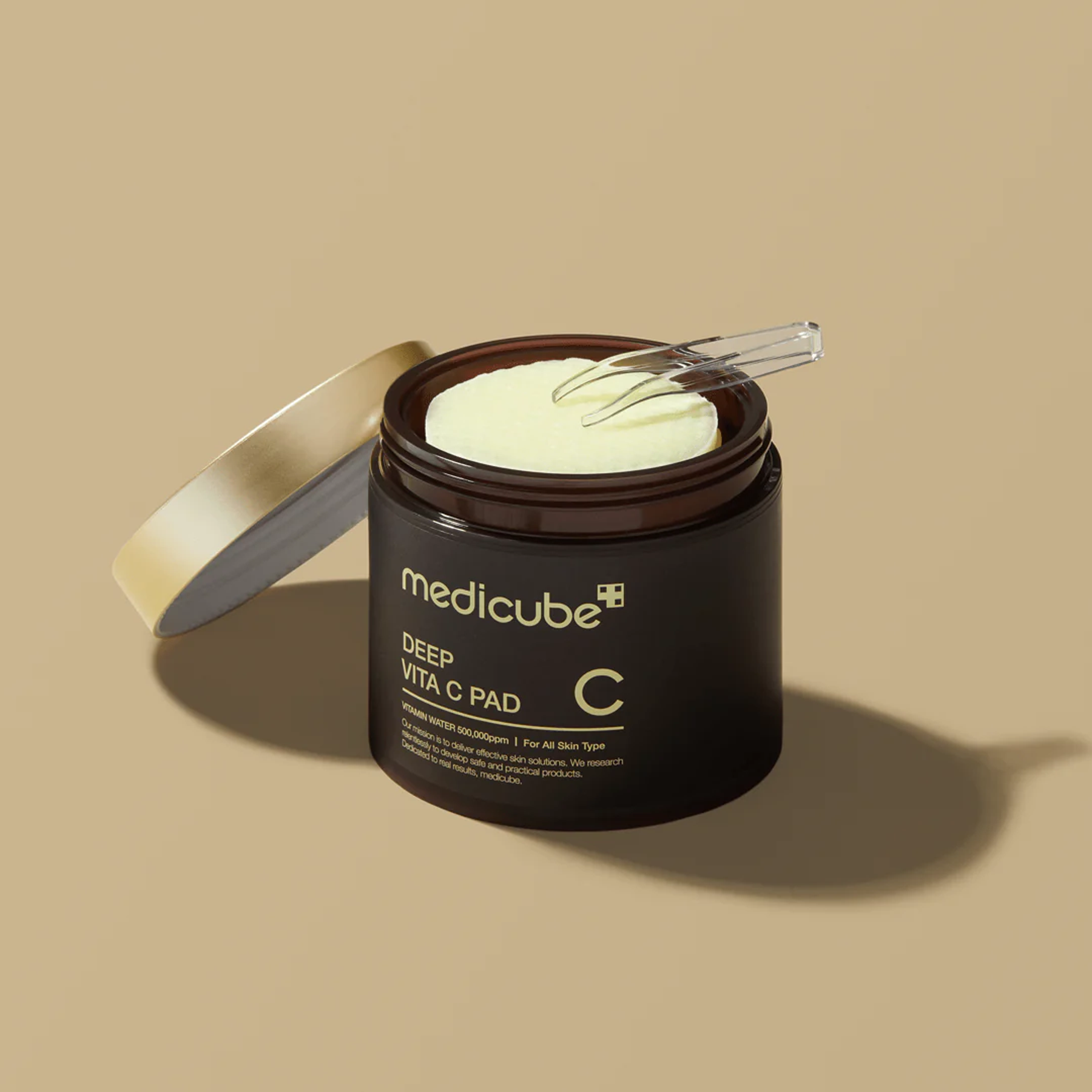 Medicube Deep Vita C Pad dual-textured design — embossed exfoliating side and silky hydrating side