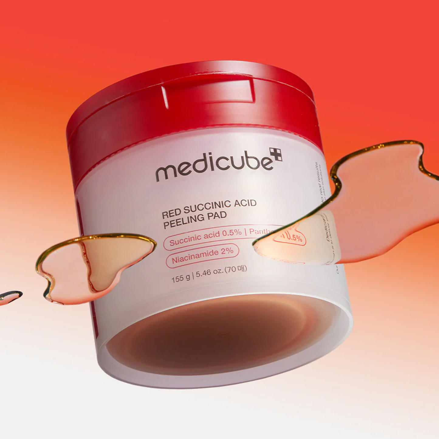 Medicube Red Succinic Acid Peeling Pad dual-textured design — textured exfoliating side and smooth soothing side