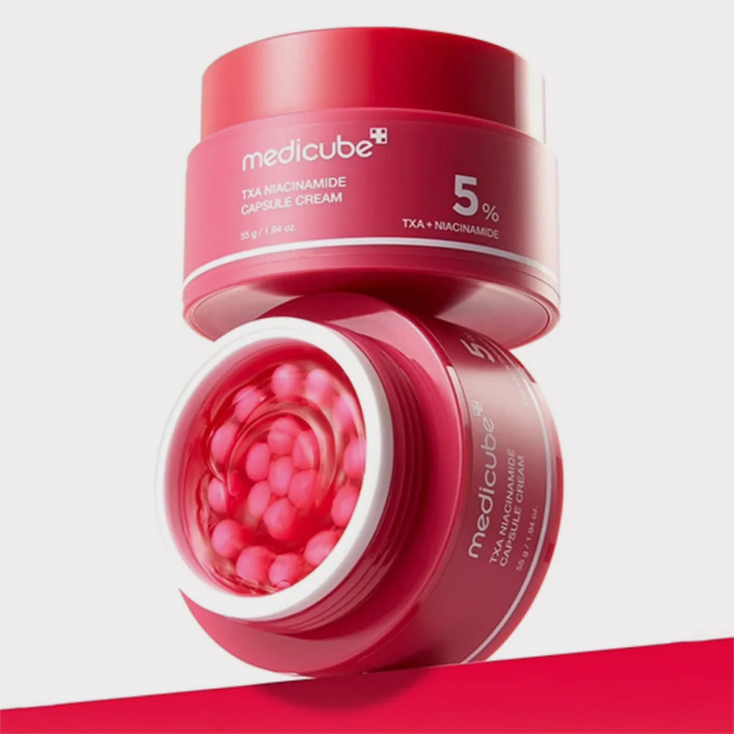 Medicube TXA Niacinamide Capsule Cream texture showing the suspended capsules in the cream